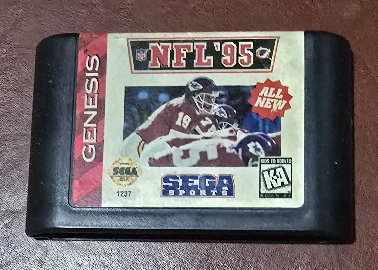 Front label of an authentic Sega Genesis NFL '95 Sega Sports cartridge