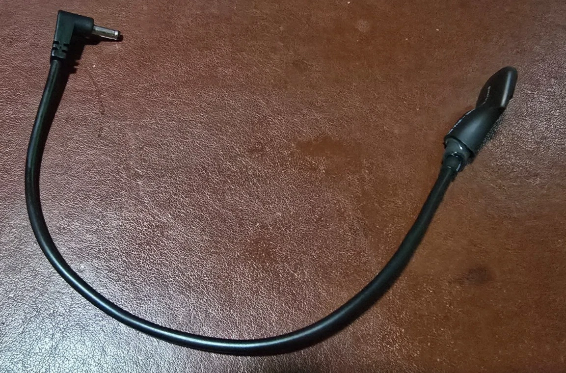 An assembled prototype USB-C power dongle, representative of what you'll receive; your unit's exact appearance will vary